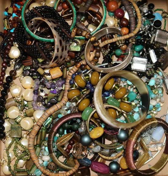 A quantity of assorted costume jewellery including bangles, necklaces etc.